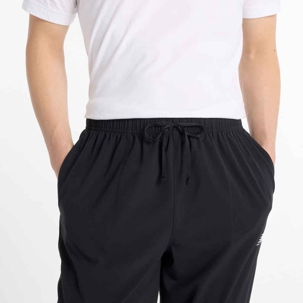брюки NewBalance муж. sport woven черн.